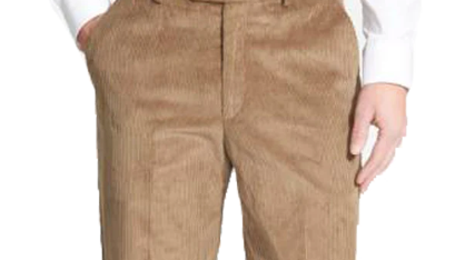 Man wearing tan colored corduroy trousers with one hand in his pocket.